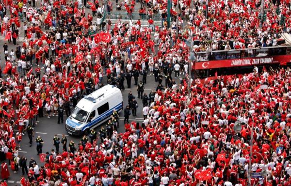 Soccer Football - Euro 2024 - Fans gather for Netherlands v Turkey - Berlin, Germany - July 6, 2024 Police officers are seen amo<em></em>ngst Turkey fans before the match REUTERS/Axel Schmidt